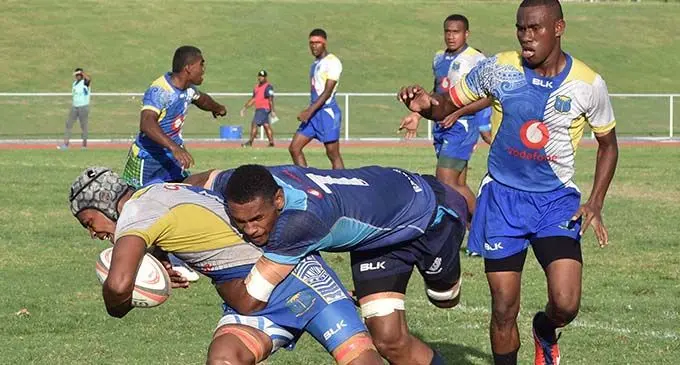 Natabua High School’s Epeli Drau is tackled by a Ratu Navula College player during the Under-18 semi-final of the Western Secondary School’s Championship at Churchill Park in Lautoka on July 13, 2019. Photo: Waisea Nasokia