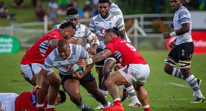 Vodafone Flying Fijians hooker Tevita Ikanivere (with ball) tries to escape the Tongan defence during their Pacific Nations Cup match at the HFC Bank Stadium on July 6, 2022, in Suva. Photo: Leon Lord
