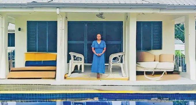 Fina Fisher with her rental property in Pacific Harbour
