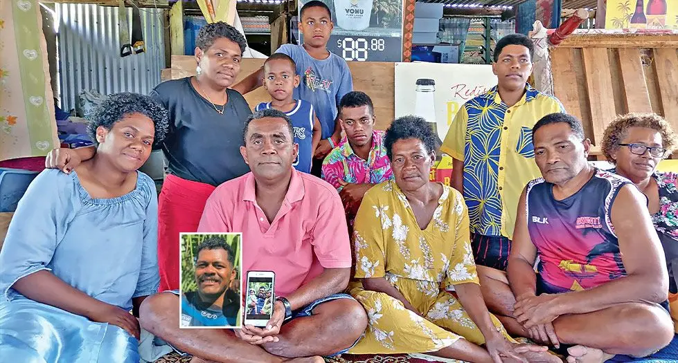The family of the deceased, Aporosa Momo holding his picture at Nasowata Settlement at Navutu in Lautoka. Photo: Mereleki Nai