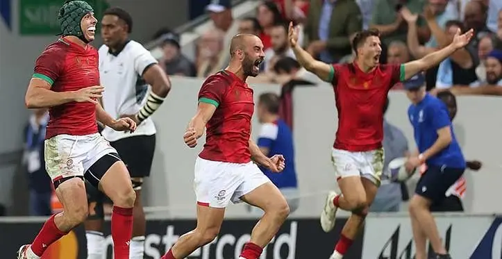 Portugal celebrate their first-ever Rugby World Cup victory against Fiji by 24-23. Picture: Charly Triballeau/AFP