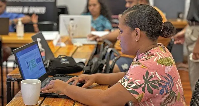 Mary Donuya working on the graphics for her website during the workshop.