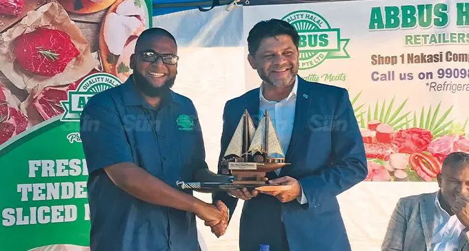 From left: Abbus Quality Halal Meats director Asad Ali gives out a token of appreciation to the Attorney-General and Minister for Economy Aiyaz Sayed-Khaiyum. Photo: Laisa Lui