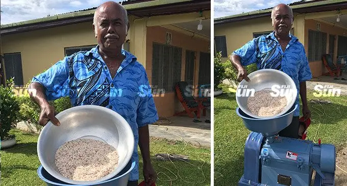 Rice farmer, Santa Ram, with a basin of rice that was milled through the new portable rice mill at Korovatu, Labasa, on February 27, 2022. Photo: Laisa Lui