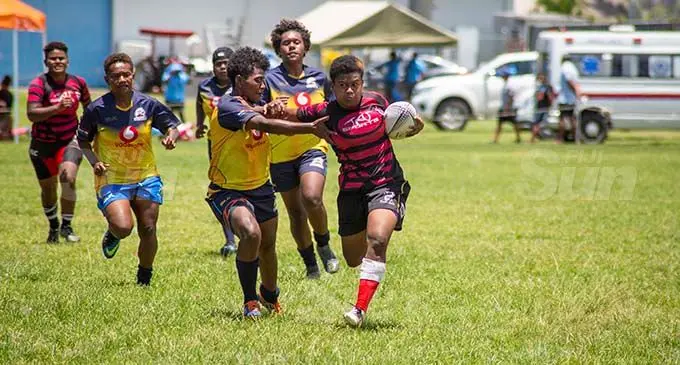 Ovalau’s Aloesi Aditarolevu (right) fends off a Northland tackler during the Region 10s Festival at Bidesi Park, Suva, on November 16,2020. Photo: Leon Lord