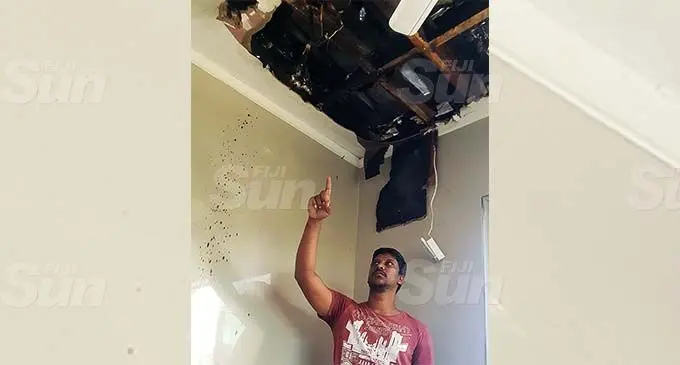 Rajneel Singh points to where he suspects the fire started at their house in Banaras, Lautoka on January 6, 2020. Photo: Nicolette Chambers