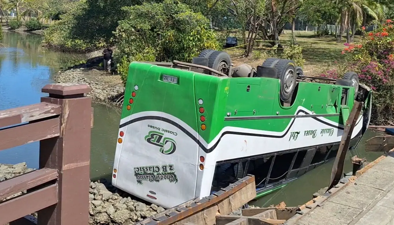 The staff bus lying upside down after plunging off the Denarau bridge on November 3, 2025