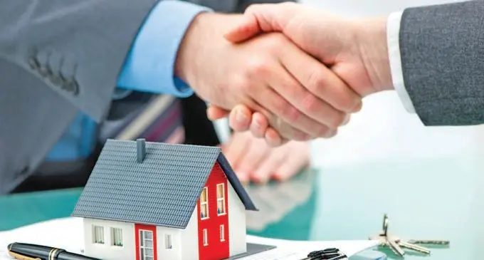 Handshakes with customer after contract signature