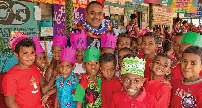 Assistant Commissioner of Police (ACP) Planning, Research and Doctrines (ACP/PRD) Aporosa Lutunauga with students of Vunidawa District School on July 7, 2023. Photos: Fiji Police Media cell