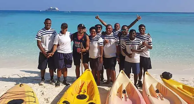 Captain Cook Cruises brand ambassador Andhy Blake (third from left) with the crew of MV Reef Endevour 2.
