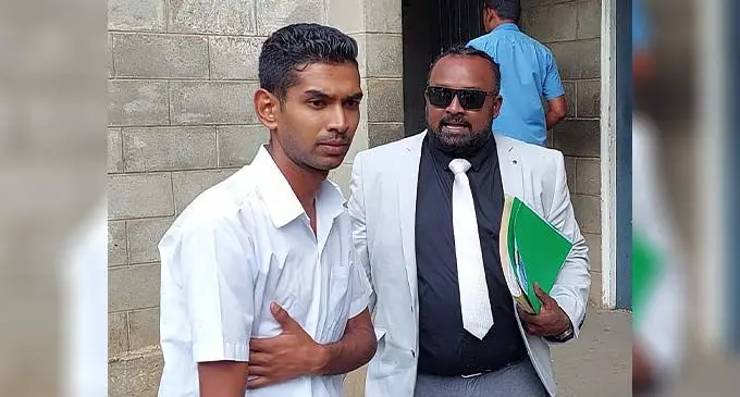 Avishek Roheel Pratap speaks to his lawyer Jarus Reuben outside the Magistrates Court in Ba on December 7, 2022. Photo: Salote Qalubau