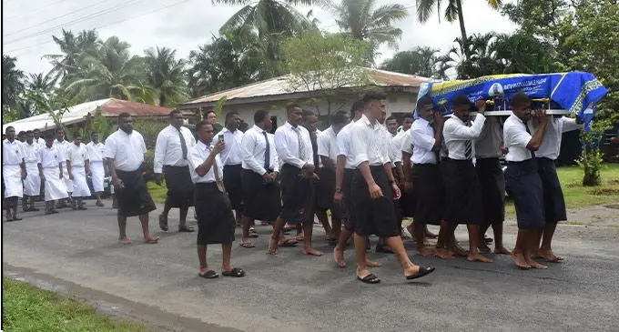 Members of the Nadi Rugby Under-19 rugby team carries the casket of Pasikeli Naevo at Nawaka Village, Nadi, today. Photo: Waisea Nasokia.
