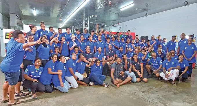 Staff members of Future Farms PTE Limited Trading as Rooster Poultry with members of the Fijiana Drua team after the annual draw at Navau, Ba on March 3, 2023. Photo: Salote Qalubau