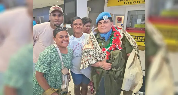 Private Mereani Wakolo (with garland), surrounded by family members at the Nadi International Airport on January 27, 2025.