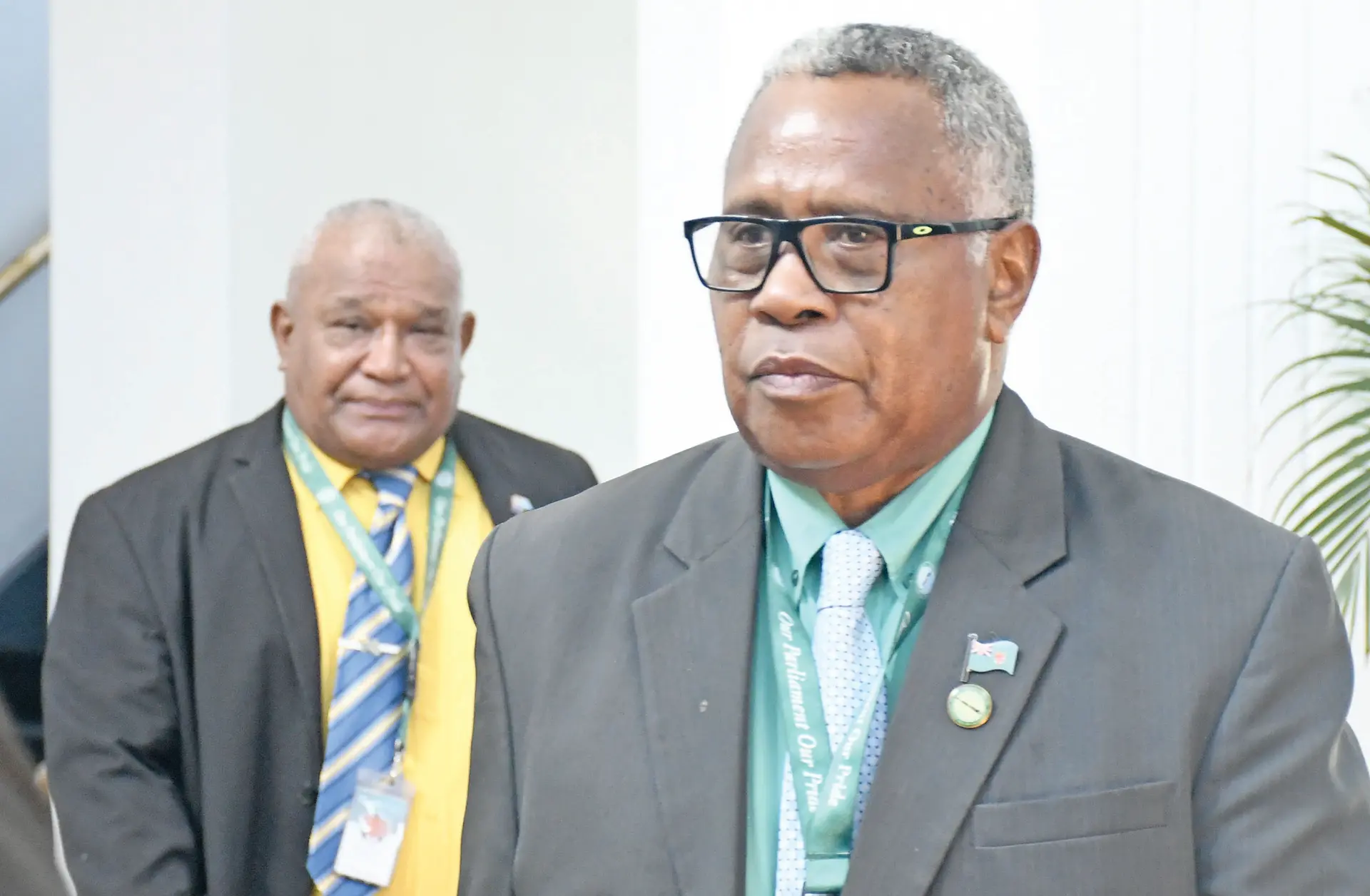 Government Member of Parliament Kalivati Ravu and Assistant Education Minister Lilesa Vanawalu outside Parliament on March 11, 2026.