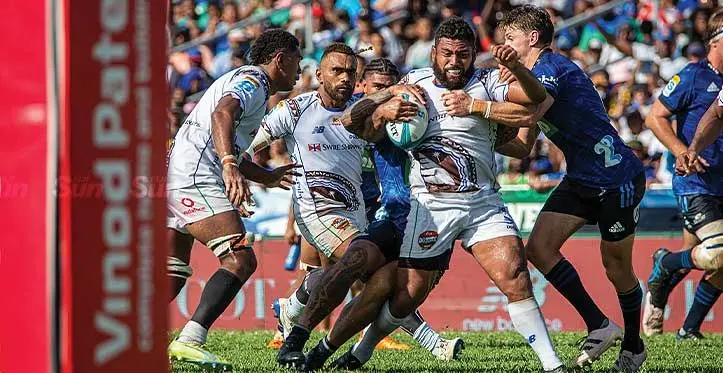 Swire Shiiping Fijian Drua prop Haereiti Hetet (with ball) tries to break through a strong Blues defence, with support play coming from Kitione Salawa {left) and Drua winger Eroni Sau at Lautoka's Churchill Park on April 29, 2023. Drua lost 14-30. Photo: Leon Lord