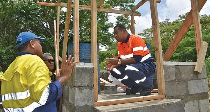 Lands and Mineral Resources minister, Filimoni Vosarogo, withe staff of the Mineral Resources Department’s Hydrology Division at the site of the new bore hole pump house.