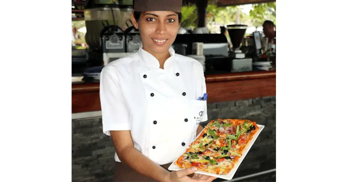 Commis chef Darshana Kumar with a Pizza Dal Mercato. Photo: Sofitel