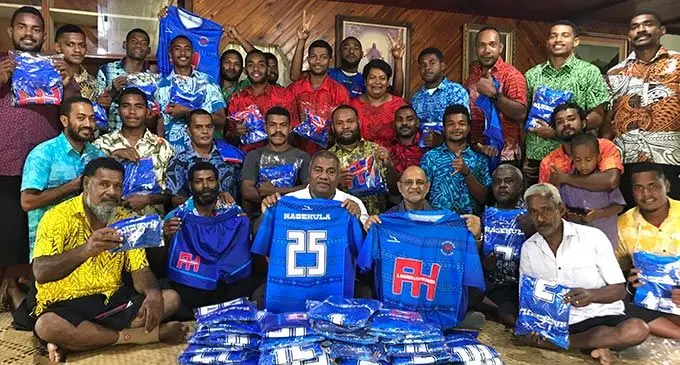 Tui Labasa Ratu Jone Qomate (front, third from left), with A Hussain & Co Pte Limited managing director Hazeem Hussein (front, fourth from left) and members of the Nasekula Rugby Club. Photo: Shratika Naidu