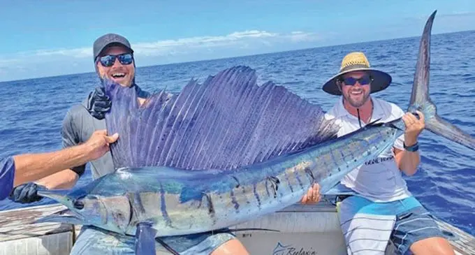Angler Scott McNair and crewman Matty Alford with their catch onboard ‘Relaxin’ on March 13, 2021. Photo: IDGSFC.