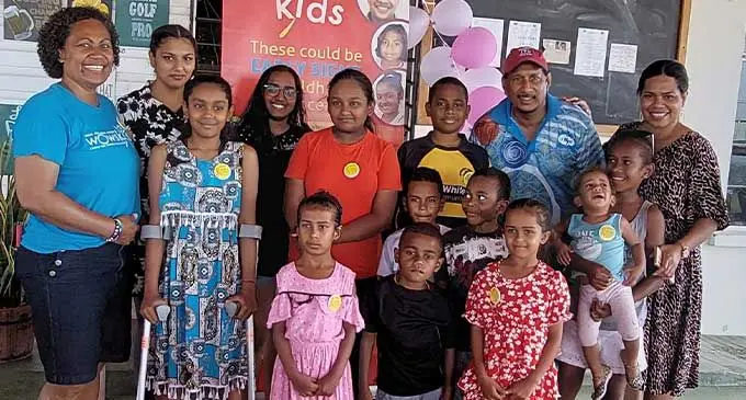 WOWS Kids team leader, Mere Williams (first from left), Lautoka Hospital staff nurse, Laisa Raisamu (first from right) with Raymond Singh, (back row, second from right) with the children during the WOWS Kids family fun day at the Lautoka Golf Club on September 24, 2022. Photo: Nicolette Chambers