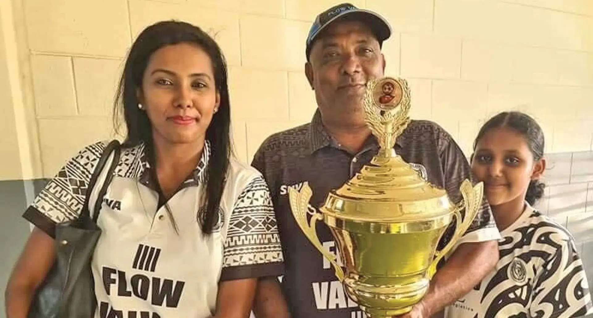 Suva football coach Babs Khan, his wife and daughter with the Vodafone Premier League Championship trophy. Photo: Suva Football