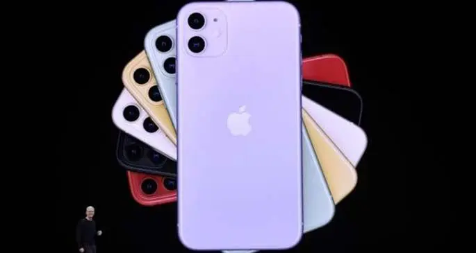 Apple CEO Tim Cook displays new iPhones during a product launch event at Apple's headquarters in California, the United States, Sept. 10, 2019. (Handout via Xinhua)