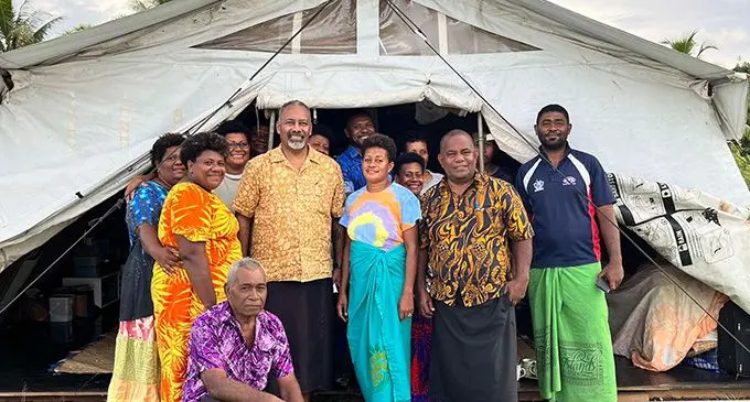 Minister for Rural and Maritime Development and Disaster Management Sakiasi Ditoka with his assistant minister Jovesa Vocea and the people of Nabavatu at the Assemblies of God Church land at Dreketi on January 4, 2023.