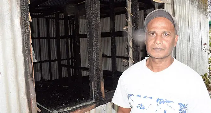 Usman Ali in front of his burnt house at Narere  on May 20, 2019.