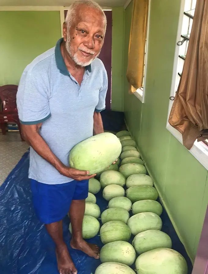 From left: Fani Cheer with his watermelons which he harvested at Karavi on August 22, 2019. Photo: Charles Chambers