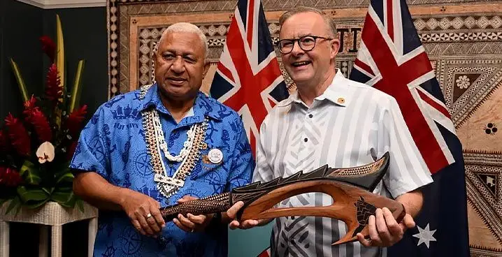 Former Fijian Prime Minister Voreqe Bainimarama with Australian Prime Minister Anthony Albanese with a war club during a bilateral meeting at the Pacific Islands Forum in July 2022. Photo: AFP