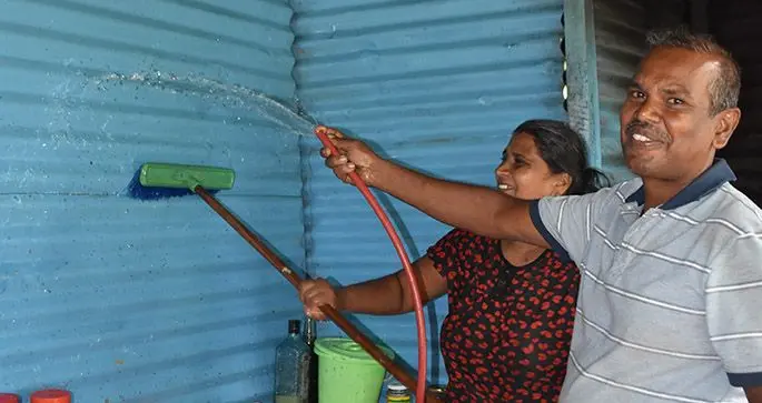 Kamal Deo helps his wife Roshni Lata clean up their home, in preparation for Diwali. Photo: Laisa Lui