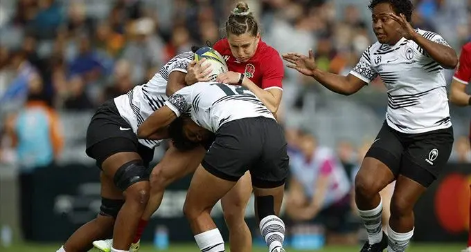 England’s Claudia MacDonald takes on the Fijiana XVs players in their Pool C opener at Eden Park, Auckland, New Zealand, today. Photo: Stuff