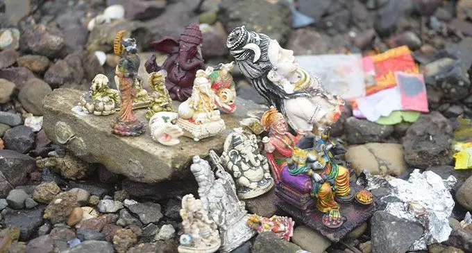 Idols were seen to be washed ashore in Laucala Bay, Suva on November 14, 2023. Inset: Tonia Serevatu, 16 with the idols he found. Photo: Ronald Kumar