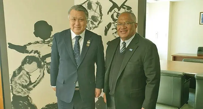 From left: Japan Football Association president Kohzo Tashima and Isikeli Mataitoga in Japan.  Photo: Fiji FA Media