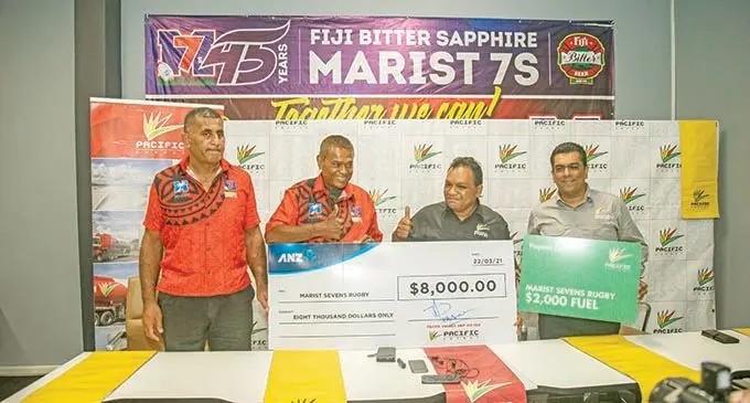 From left: Fiji Bitter Marist 7s tournament coordinator Koli Korovulavula, Marist Rugby Club president Lawrence Tikaram Pacific Energy’s chief marketing officer, Rajnesh Prasad, and Amit Maharaj, commercial /business manager lubricants, during the cheque handover  in Suva on March 22, 2021. Photo: Leon Lord