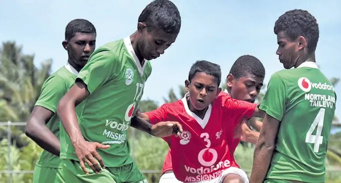Nimish Prasad, 12, of Rewa is sandwiched by Northland Tailevu defenders during the Vodafone U16 Youth League at Fiji FA Academy ground in Suva on March 10, 2018. Prasad scored the final goal in Rewa’s 4-0 victory. Photo: Fiji FA Media