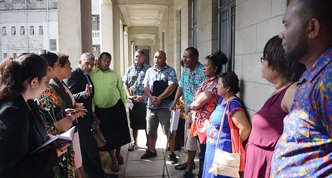 Minister for Women, Children and Poverty Alleviation Mereseini Vuniwaqa (third from left), and Minister for Commerce, Trade, Tourism and Transport Faiyaz Koya (fourth from left), with Flea Market stall owners and workers outside Parliament on May 27, 2020.  Photo: Ronald Kumar