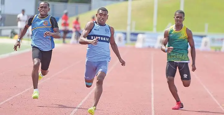 Netani Lolo of Queen Victoria School (middle) won the senior boys 100meters Tailevu Zone heat 2 at HFC Bank Stadium on April 12, 2023. Photo: Ronald Kumar.