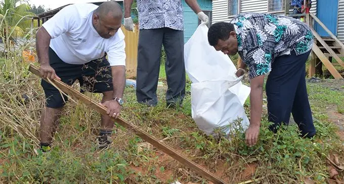 Minister for Health Dr. Ifereimi Waqainabete (left) Waidamudamu Settlement, of Nakasi Community Development President, Mahebob Ali and Pastor Manua Kalaunaviti while cleaning up at Waidamudamu settlement following the launching  of Rewa subdivision clean-up campaign on April 20, 2019. Photo: Ronald Kumar.