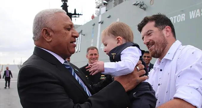 Prime Minister Voreqe Bainimarama meets toodler Cooper Brenton onboard the HMAS Adelaide in Sydney, Australia on September 14, 2019. PM's Office