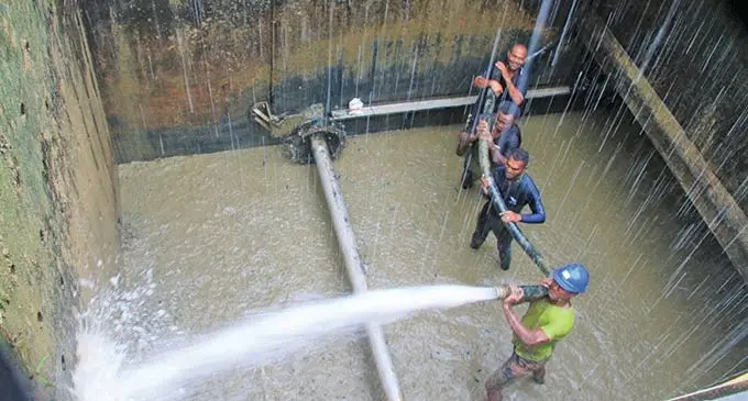  Water Authority of Fiji crew clear block pumps and to de-silt the water treatment plant clarifier which had excessive sludge.  Photo: Water Authority of Fiji