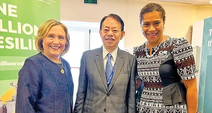 From Left: Hillary Clinton and (right) Minister for Women, Children and Social Protection Lynda Tabuya.