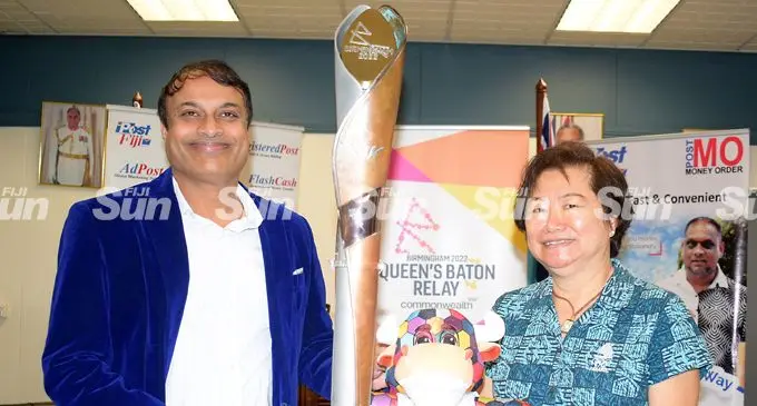 Post Fiji Chief Executive Officer, Anirudha Bansod (left) hands over the Commonwealth Games Queens baton to FASANOC chief executive officer, Lorraine Mar on February 8, 2022. Photo: Ronald Kumar