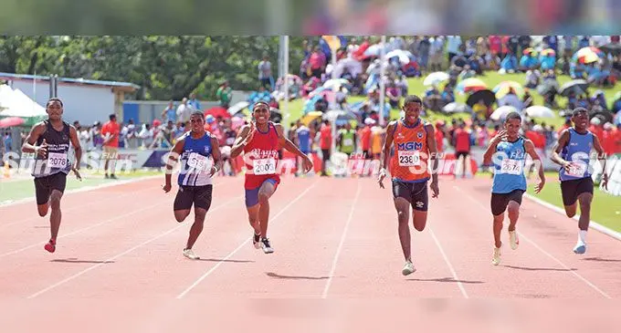 Mahatma Gandhi Memorial School’s (MGM) Emosi Laqere (third from left), wins his Coca-Cola Games intermediate boys 100 metres heat, clocking 11.91 seconds, at the HFC Bank Stadium in Suva on April 27, 2023. Photo: Ronald Kumar 