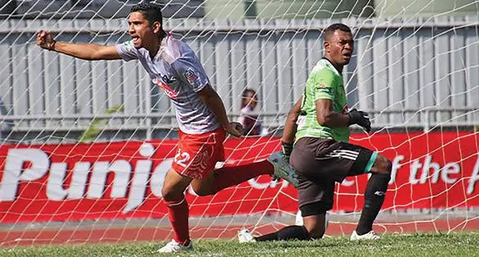 Farmtrac Tractors Labasa midfielder Ashnil Raju celebrates his goal as a frustrated Rewa goalkeeper Emori Ragata looks on during the Punjas Battle of the Giants final against Rewa at Churchill Park, Lautoka, on September 4, 2022. Labasa won 2-1. Photo: Fiji FA Media