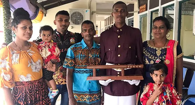Baton of Honour recipent Ravinesh Ram with his family after the passing-out parade on April 24, 2019.  Photo: Kelera Sovasiga