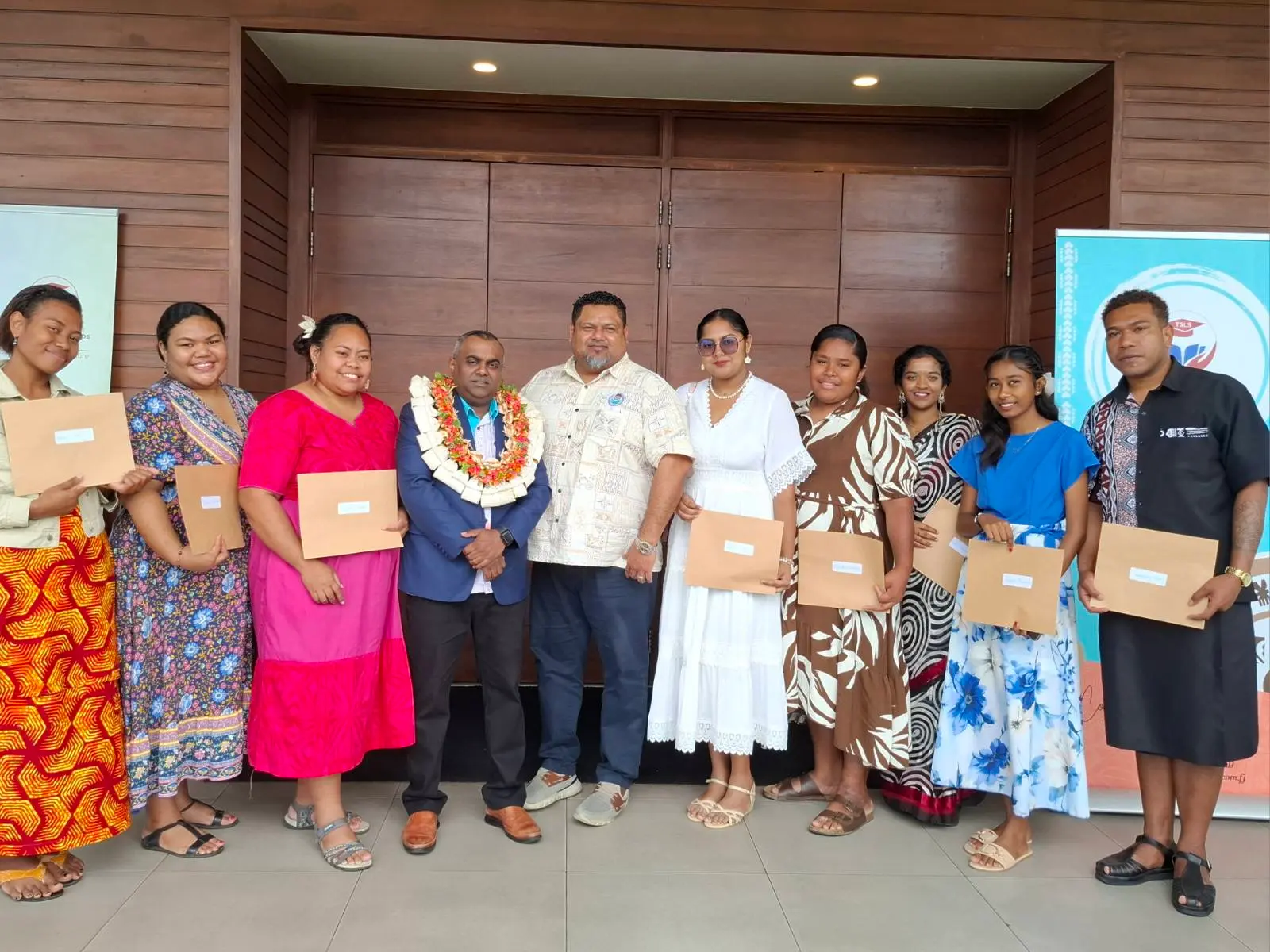 Tertiary Scholarships & Loans Service Head of Student Services Avinay Kumar with grants recipients on September 16, 2026.