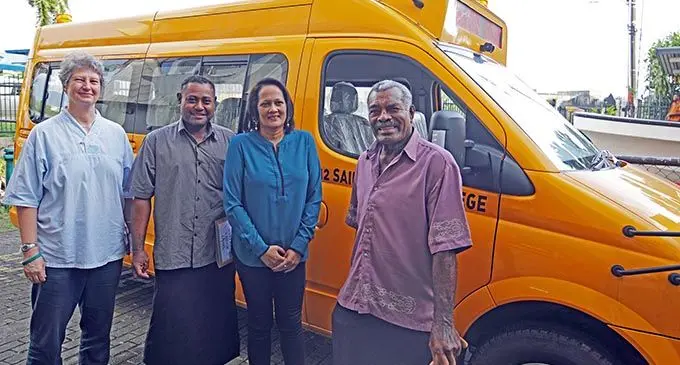 Permanent Secretary for the Ministry of Education, Heritage and Arts Alison Burchell (left) with the Minister for Education, Heritage and Arts Rosy Akbar (third from left) hands over a school bus as part of Government’s  transport assistance to St John’s College in Levuka. Photo: DEPTFO News 