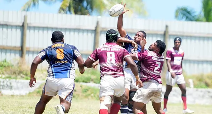 Players of the Freshet Navy Blues side tussle for the ball against Nabua Broncos at Bidesi Park, Suva, on October 21, 2023. Photo: Ronald Kumar. 